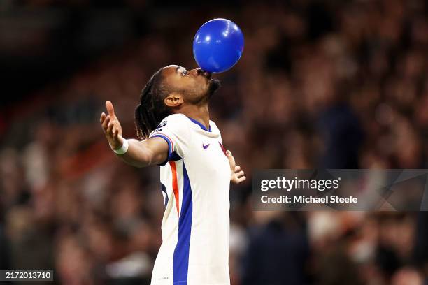 BOURNEMOUTH, ENGLAND - SEPTEMBER 14: Christopher Nkunku of Chelsea celebrates scoring his team's first goalby blowing up a ballon during the Premier League match between AFC Bournemouth and Chelsea FC at Vitality Stadium on September 14, 2024 in Bournemouth, England.